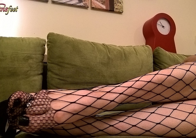 Enjoy a 3 minute close-up of Footsie Sissy’s feet in black fishnet tights